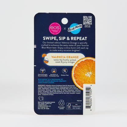 Navy-backed lip balm package with text reading “SWIPE, SIP & REPEAT” and “VALENCIA ORANGE tastes like freshly‑picked, sweet & juicy oranges,” shown with sliced orange imagery and eos × Blue Moon branding.