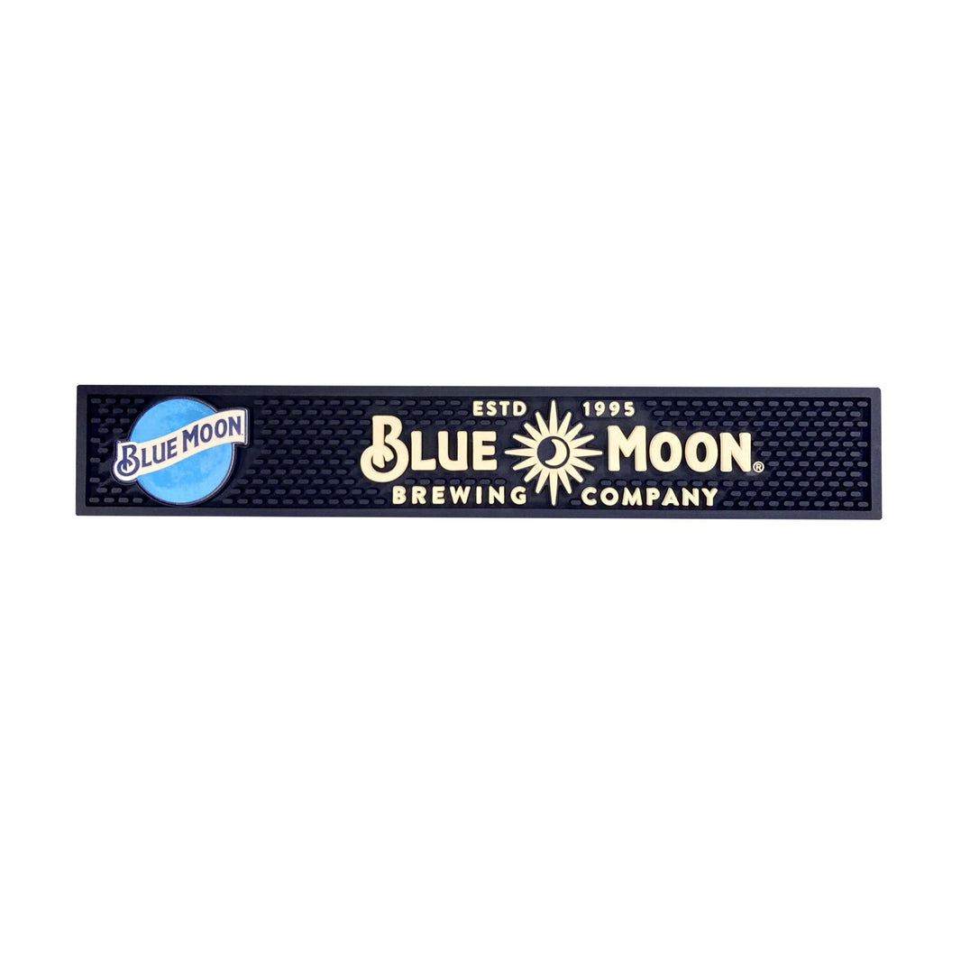 Navy bar mat with the Blue Moon logo on the left and “ESTD 1995 BLUE MOON BREWING COMPANY®” in cream text across the center.